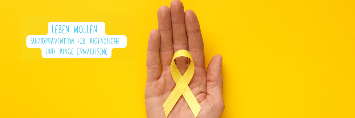 Man sieht eine Hand, die ein gelbes Ribbon hält, auf gelbem Hintergrund.